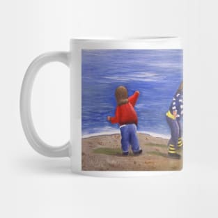 Playing on the beach Mug